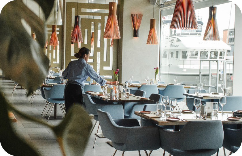 Waitress setting a table