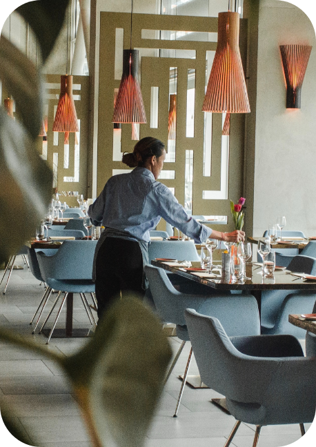 Waitress setting a table